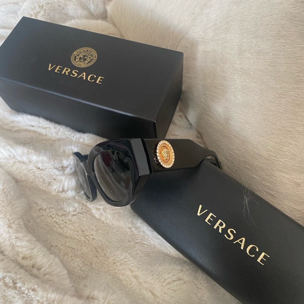 Authentic Versace Sunglasses with gold crest.